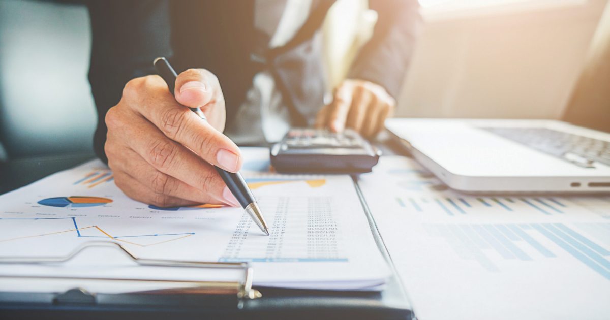 Business concept. Business people discussing the charts and graphs showing the results of their successful teamwork.